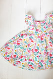 Ruffle twirl dress in Hummingbird Garden