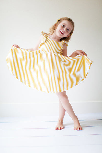 Ruffle twirl dress in yellow stripes