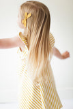 Ruffle twirl dress in yellow stripes